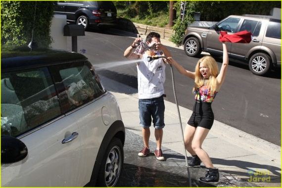 Jennette-McCurdy---washes-her-car-in-her-driveway-in-LA