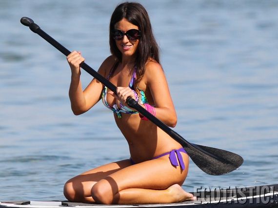 claudia-romani-paddleboarding-in-a-thong